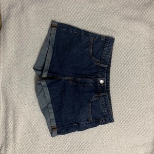 Medium wash jean shorts.